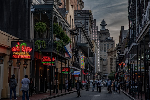 new orleans main street with shops and balconies on both sides